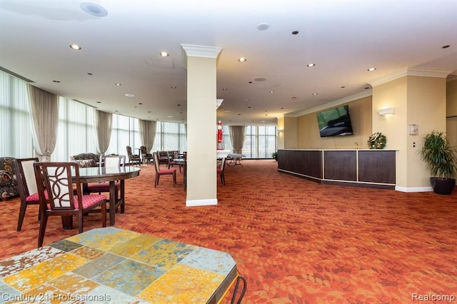 carpeted dining room featuring ornamental molding