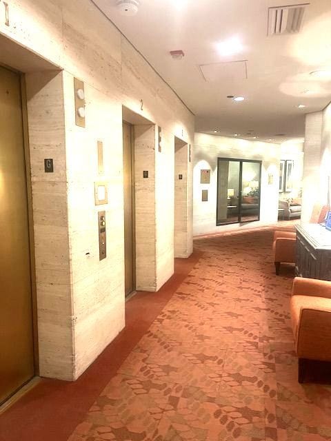 hallway featuring elevator