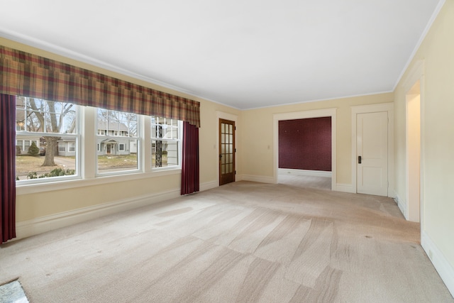 carpeted empty room with crown molding