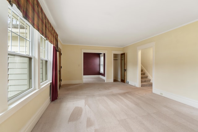 carpeted empty room with ornamental molding