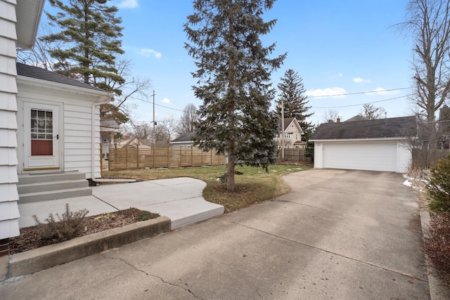 view of yard with an outbuilding and a garage