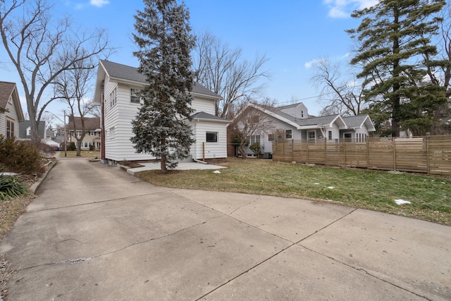 rear view of house with a lawn