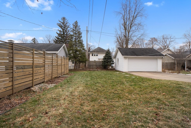 view of yard with a garage and an outdoor structure