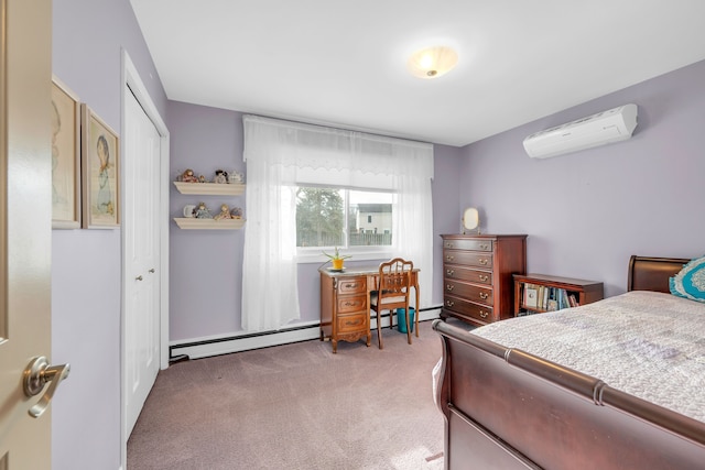 carpeted bedroom with a baseboard radiator, a closet, and a wall mounted AC