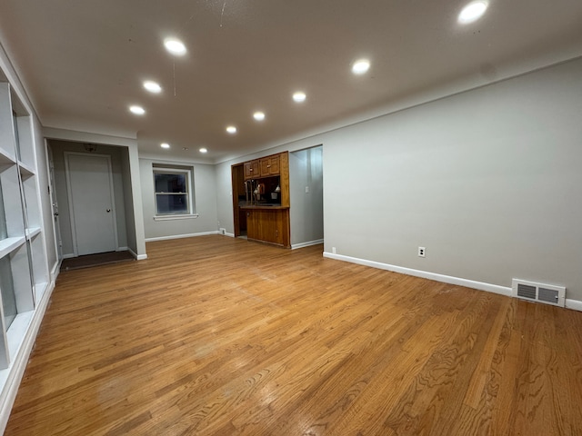 unfurnished living room with light hardwood / wood-style floors