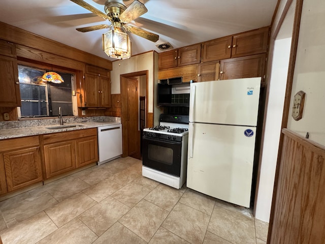 kitchen with ceiling fan, white appliances, and sink