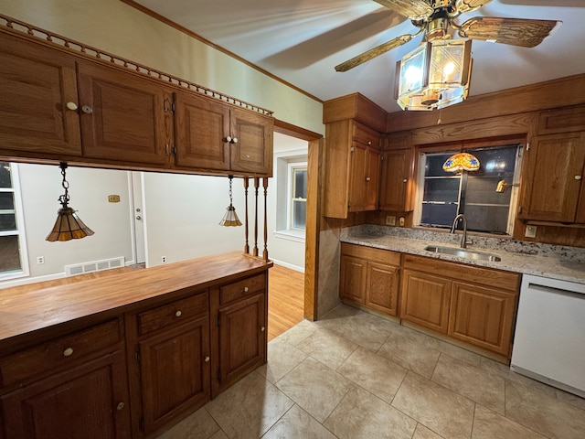 kitchen featuring wood counters, decorative light fixtures, sink, ornamental molding, and white dishwasher