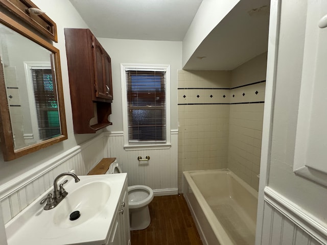 bathroom with vanity, hardwood / wood-style floors, and toilet