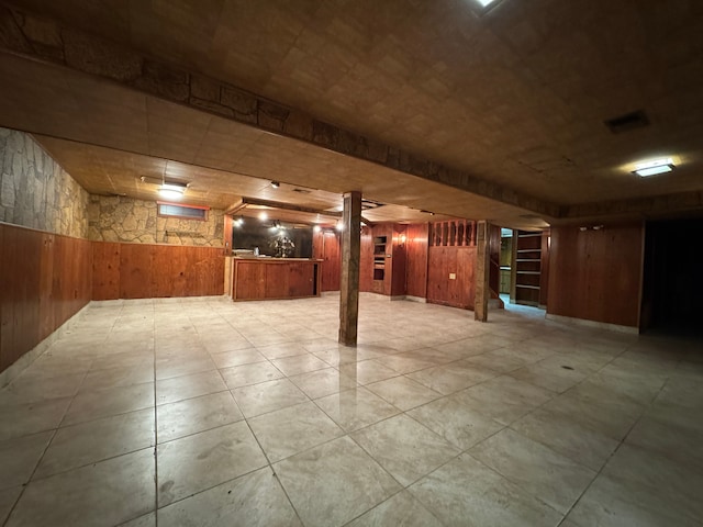 basement with wood walls