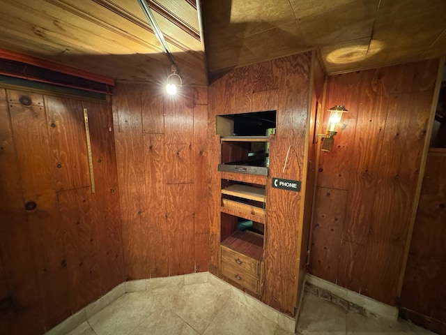 interior space featuring wooden walls