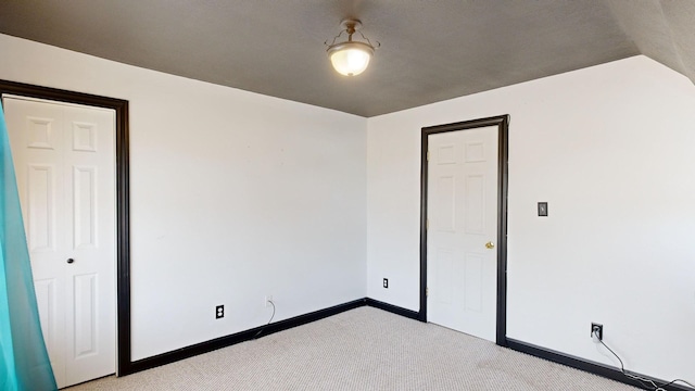 unfurnished bedroom with light carpet