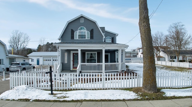 view of front facade featuring a garage and covered porch