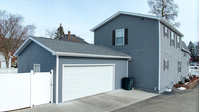 view of property exterior featuring a garage