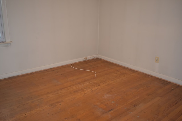 empty room featuring wood-type flooring