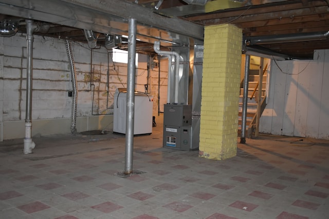 basement featuring washer / clothes dryer and heating unit