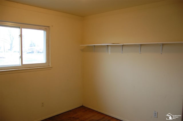 empty room with dark wood-type flooring