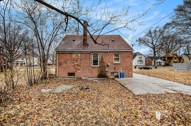 rear view of house featuring central AC unit