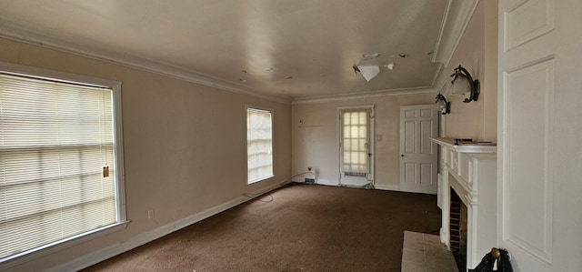 unfurnished living room featuring a fireplace, crown molding, and carpet floors