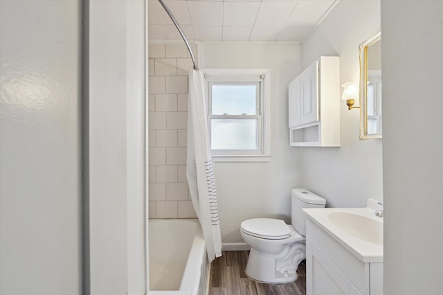 full bathroom featuring hardwood / wood-style flooring, vanity, toilet, and shower / bath combo