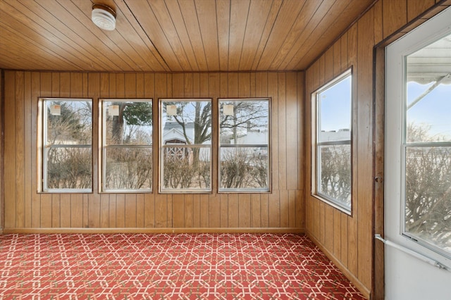 unfurnished sunroom featuring wooden ceiling