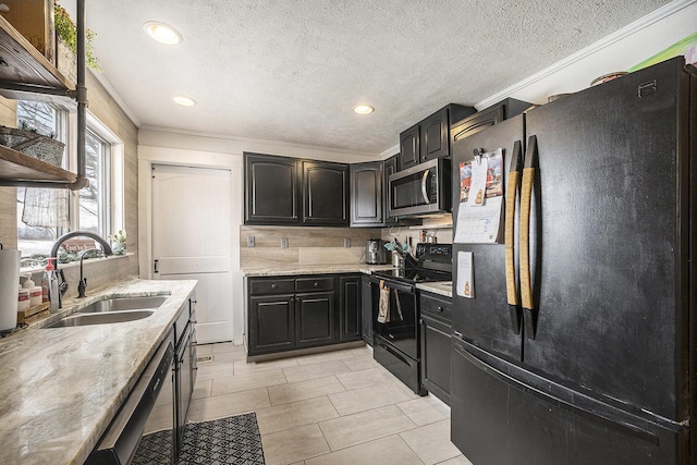 kitchen featuring sink, light stone counters, black appliances, crown molding, and a textured ceiling