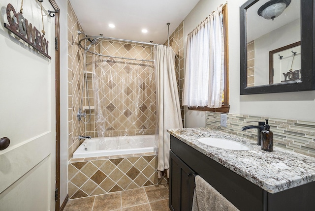 bathroom featuring tasteful backsplash, shower / tub combo with curtain, and vanity