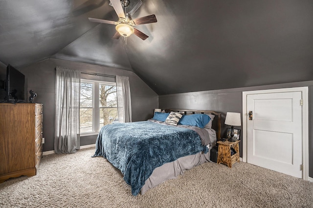 carpeted bedroom featuring vaulted ceiling and ceiling fan