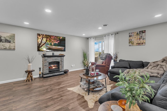 living room featuring hardwood / wood-style floors and a fireplace