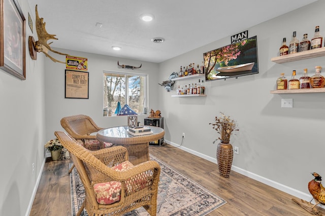 sitting room featuring hardwood / wood-style flooring