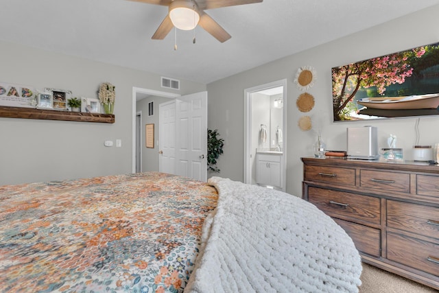 bedroom with ceiling fan and ensuite bathroom