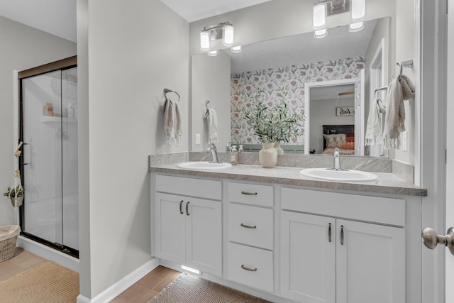 bathroom with vanity, an enclosed shower, and tile patterned flooring