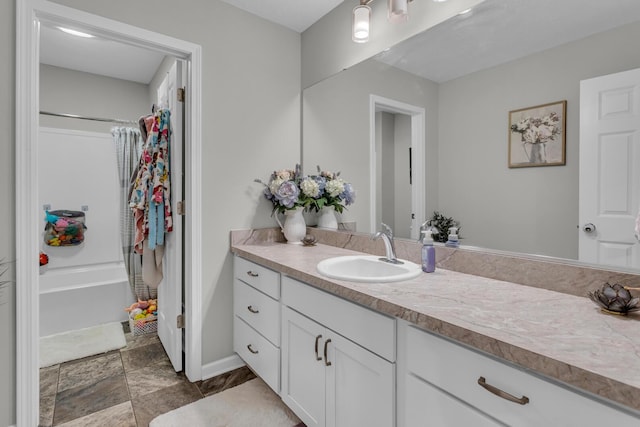 bathroom with vanity and shower / bath combo with shower curtain