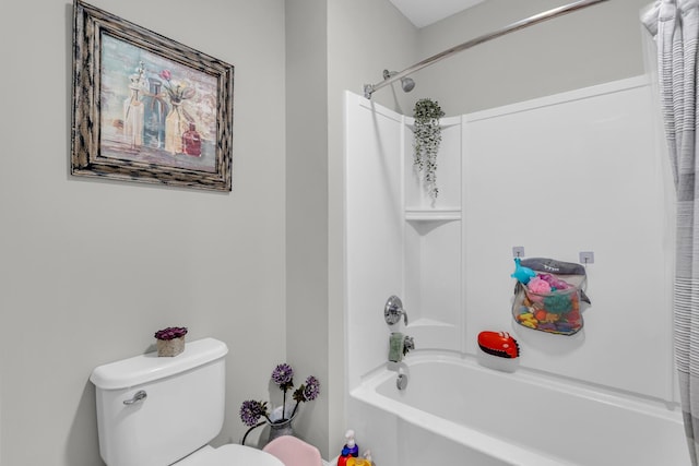 bathroom featuring shower / bathtub combination with curtain and toilet