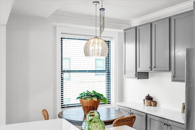 dining space with ornamental molding