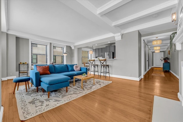 living room featuring hardwood / wood-style floors and beamed ceiling