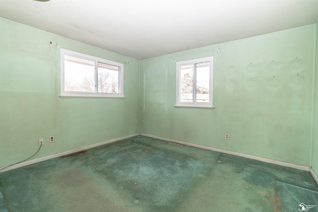 empty room featuring carpet flooring