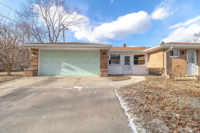 ranch-style house featuring a garage