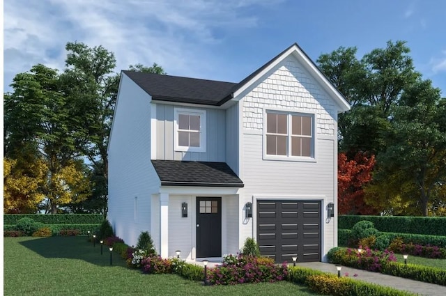 view of front of house with a garage and a front lawn