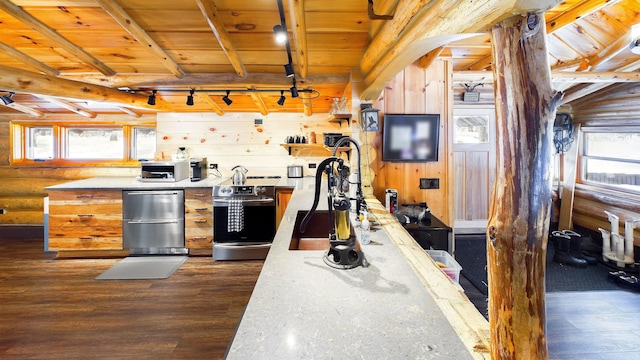 kitchen featuring wood ceiling, a healthy amount of sunlight, rail lighting, and dark wood-style flooring