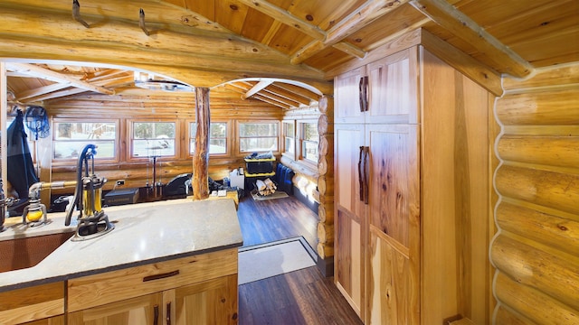 kitchen with dark wood-style floors, wood ceiling, and lofted ceiling with beams