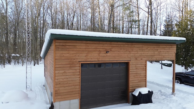 view of snow covered garage