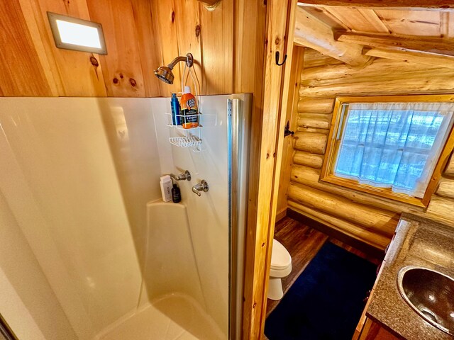 full bath with a walk in shower, toilet, and a sink