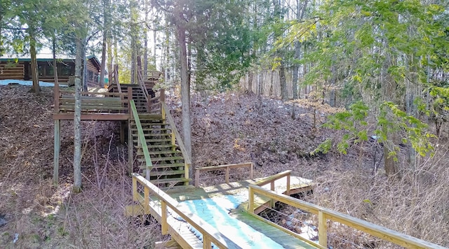 view of yard with stairway and a deck