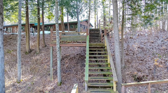 view of yard featuring stairs and a wooden deck