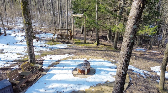 view of yard featuring a wooded view