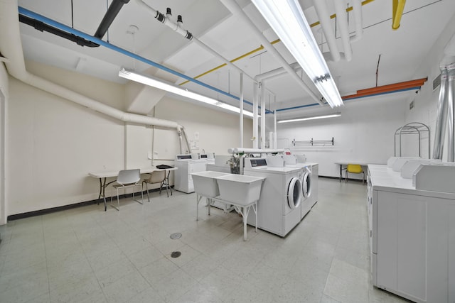 washroom featuring sink and washing machine and clothes dryer