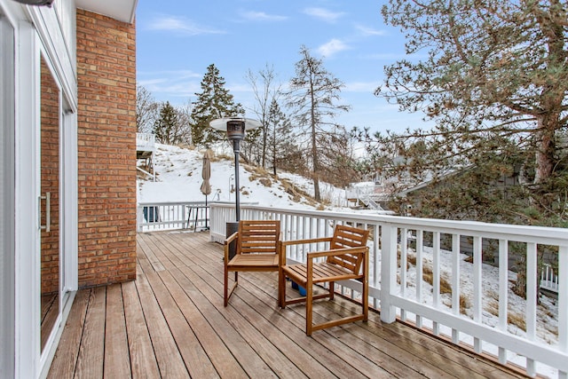 view of snow covered deck