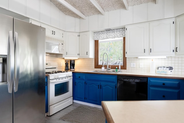 kitchen with white cabinetry, sink, white appliances, and blue cabinetry