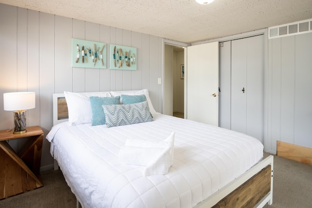 carpeted bedroom with a closet