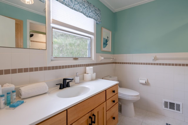 bathroom featuring tile walls, tile patterned flooring, vanity, ornamental molding, and toilet